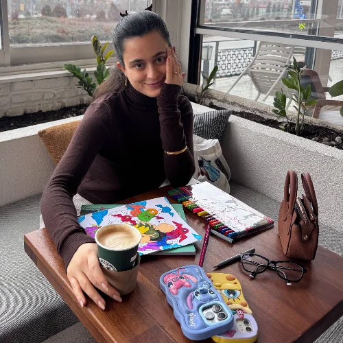 Aynur E.